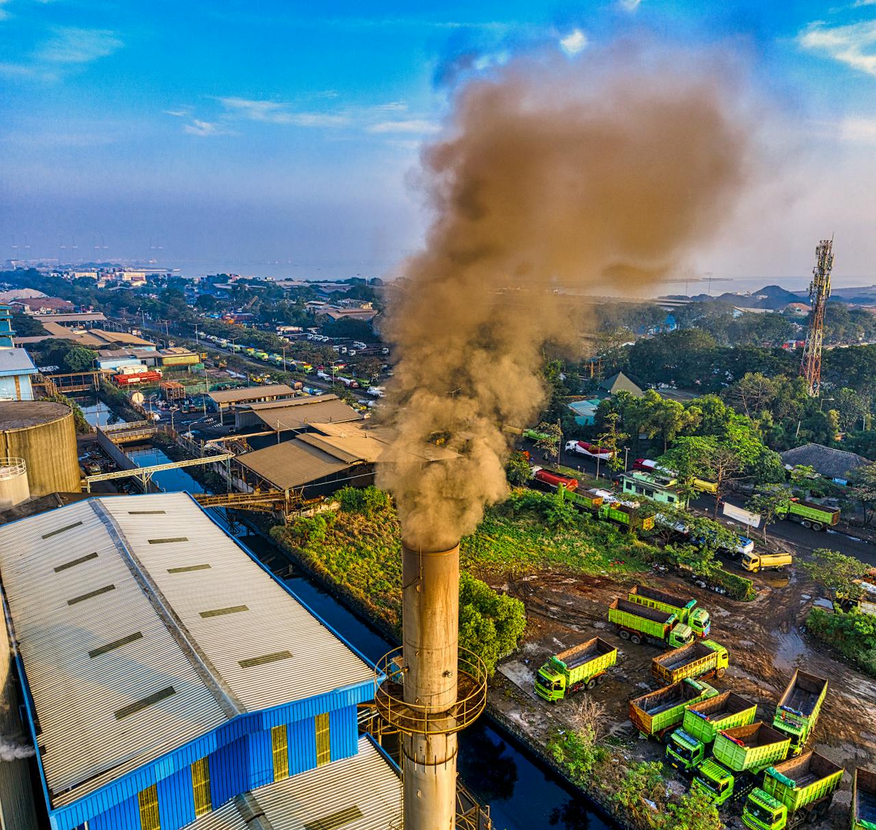 Aerial photograph showcasing air pollution from a factory in Jakarta, Indonesia.